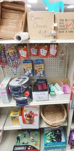 lot 149 image: Paper Bags, pool mat, card games, kids workbooks, cornhole, rubber snakes, flash cards, wallets, foot pumps