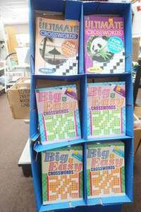 lot 202 image: Crossword Puzzle Books and Display Stand