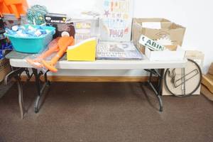 lot 232 image: Metal Signs, Collapsible Oars, Game Scales, Clear Storage Totes and Lids, Fur, 2 Boxes of Carineaners