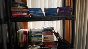 lot 186 image: Covered Tote of Paperback, Hardcover Books.