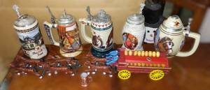 lot 329 image: Anheuser Busch Steins (5) and Cast Keg Wagon  Beautiful, COA.