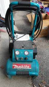 lot 176 image: Makita Air Compressor 5 gal. 3 HP with Cart and Hose.