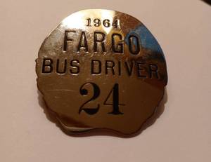lot 378 image: Vintage 1964 Fargo Bus Driver Badge