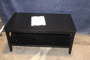lot 8 image: Black Coffee Table with Shelf and Minor Edge Damage