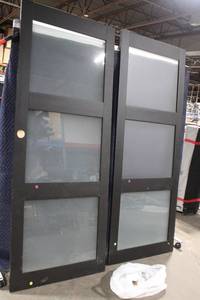lot 23 image: Pair of 32-Inch Wide Black Frosted Glass Sliding Doors with Hardware