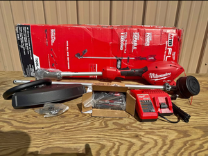 lot 32 image: Milwaukee M18 FUEL 16 in. Brushless Battery String Trimmer wQUIK-LOK  8.0 Forge Battery  Charger