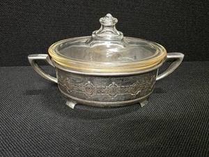 lot 14 image: Vintage glass Pyrex dish with lid and silver carrier