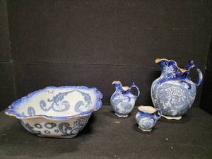 lot 57 image: Antique Four-Piece Royal Doulton Floral Blue Pitcher, Wash Basin, Jug and Mug