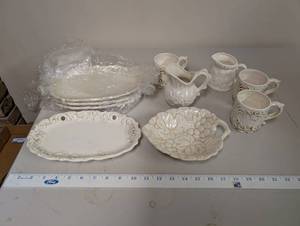 lot 619 image: Collection of Embossed White Ceramic Serving Pieces and Mugs