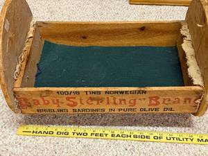 lot 541 image: Vintage Wooden Box Cradle with Baby Sterling Brand Sardines Print