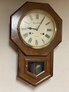 lot 595 image: Montgomery Ward 30 Day Wall Clock with Octagonal Wood Case