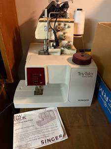 lot 752 image: Singer Tiny Tailor Mending Machine, Baby Lock 418 Serger, Patterns, and Thread Collection