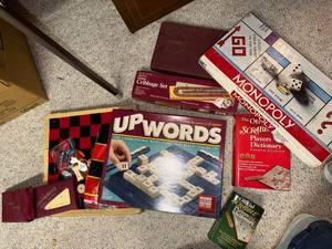 lot 766 image: Collection of Classic Board Games including Monopoly, Upwords, Cribbage, and Scrabble Dictionary