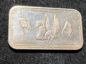 lot 69 image: 1 TROY OZ .999 FINE SILVER INTERNATIONAL TRADE UNIT BAR