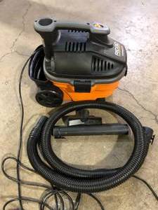 lot 54 image: RIDGID 4 Gal. 5.0 Peak HP Portable Shop Vacuum Wet Dry Vac with Fine Dust Filter, Locking Hose and Attachments WD4070 Used Good  Customer Returns See Pictures