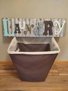 lot 74 image: Laundry Wall Decor & Basket