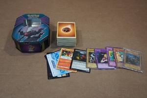 lot 101 image: Assorted Pokemon Cards and Tin