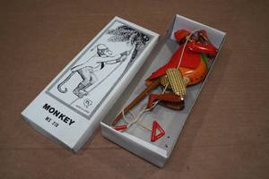 lot 176 image: Vintage Look Tin Litho Climbing Monkey