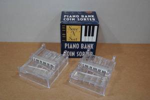 lot 179 image: Piano Bank Coin Sorter