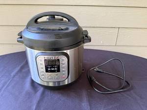 lot 10 image: Instant Pot Duo 6-Quart Multi-Use Programmable Pressure Cooker with Power Cord