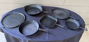 lot 12 image: Set of Assorted Cast Iron Skillets and Grill Pans
