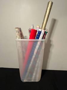 lot 23 image: Assorted Gift Wrap and Wrapping Paper Rolls in Plastic Bin