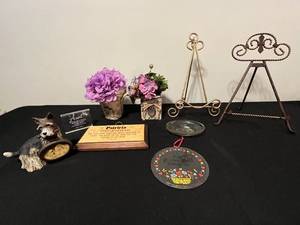 lot 29 image: Assorted Home Decor Lot with Easels, Dog Figurine, Floral Arrangements, and Plaques