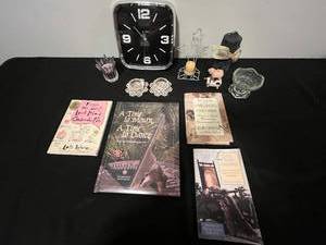 lot 53 image: Mixed Lot of Family-Themed Books, Decorative Glassware, and Wall Clock
