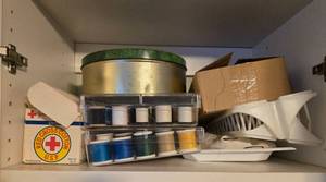 lot 79 image: Sewing and Craft Supplies Bundle with Thread Spools, Red Cross Cotton, and Magazines