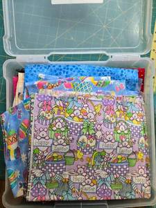 lot 89 image: Easter and Spring-Themed Quilting Cotton Fabric Scrap Bundle in Storage Box