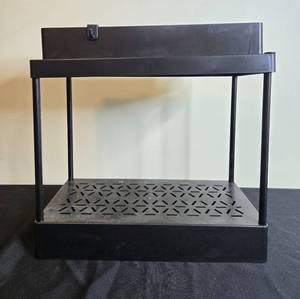 lot 126 image: Black Two-Tier Plastic Storage Rack with Perforated Shelves