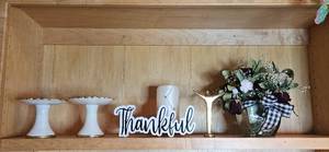 lot 139 image: Decor Collection with Pedestal Stands, Brass Figure, Thankful Sign and Floral Arrangement