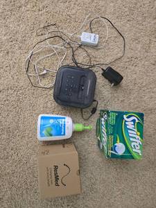 lot 324 image: Household Electronics and Supplies Lot with Radio, Swiffer Refills, Lotion