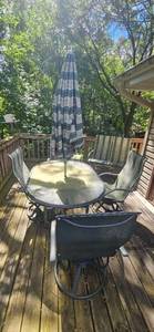 lot 337 image: Patio Furniture Set with Glass Table, 4 Swivel Chairs, Bench Glider, Bistro Table, and Umbrella