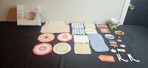 lot 345 image: Home Kitchen Collection with Glass Mug Set, Golf Mugs, Pot Holders, Linens, and Fall Decor