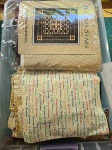 lot 369 image: Thimbleberries Holiday Stars Quilt Kit with Assorted Christmas Fabric Remnants