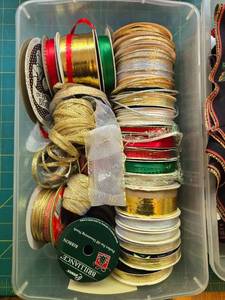 lot 380 image: Craft Supplies Collection with Assorted Ribbons, Fabric Pieces, and Yarn