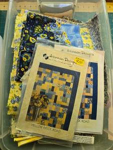 lot 382 image: Yellow Brick Road Quilt Kit with Atkinson Designs Patterns and Assorted Blue and Yellow Fabrics