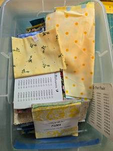 lot 383 image: Collection of Quilting Fabric Scraps and Moda Flora Charm Pack