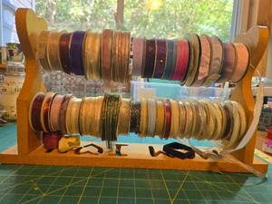 lot 384 image: Collection of Assorted Decorative Ribbon Spools with Wooden Rack