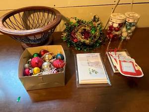 lot 411 image: Holiday Decor Lot with Ornaments, Garland, Cards, Mitten Tags and Wood Wire Bowl