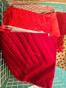 lot 435 image: Collection of Red and Pink Heart-Themed Quilting Fabric Pieces