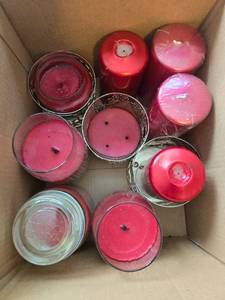 lot 439 image: Collection of Red and Ivory Candles in Glass and Pillar Styles