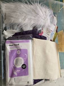 lot 440 image: Quilting and Sewing Supply Lot with Faux Fur, Fabric Strips, and Interfacing