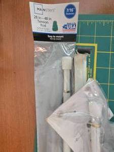 lot 444 image: MansTays Tension Rod 28-48 Inch with Accessories and Ironing Board Cover
