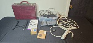 lot 454 image: Collection of Laptop Accessories, Surge Protectors, Wires, and Vintage Briefcase