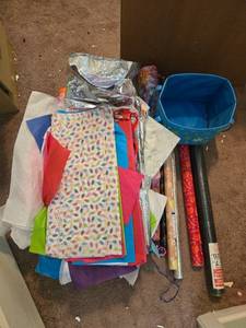 lot 487 image: Assorted Gift Wrap Supplies with Tissue Paper, Wrapping Paper, and Storage Bin