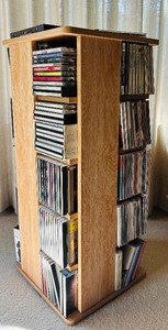 lot 147 image: Rotating Media Storage Tower with Assorted CDs and Box Sets