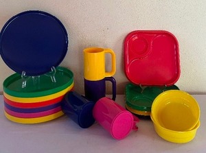 lot 132 image: Vintage Colorful Plastic Dinnerware Set with Plates, Trays, Mugs, and Bowls