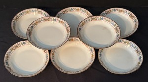 lot 101 image: Set of 8 Limoges UC France Porcelain Bowls with Floral and Butterfly Rim